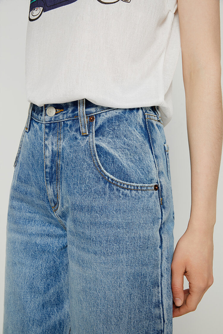 Light blue 80's utility loose jeans by Hey Joanie with relaxed fit and classic denim texture, shown on a model.