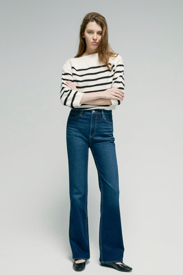 Hey Joanie Barbara high rise bootcut jeans in dark wash, shown on a model with front pockets and fitted waist.