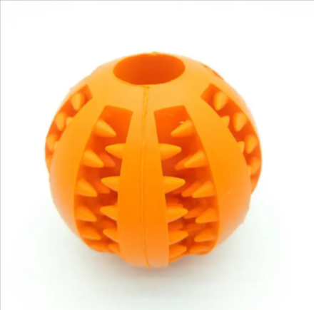 Interactive rubber slow feeder dog ball by C&M Treasures, featuring textured surface for fun and mental stimulation during play.