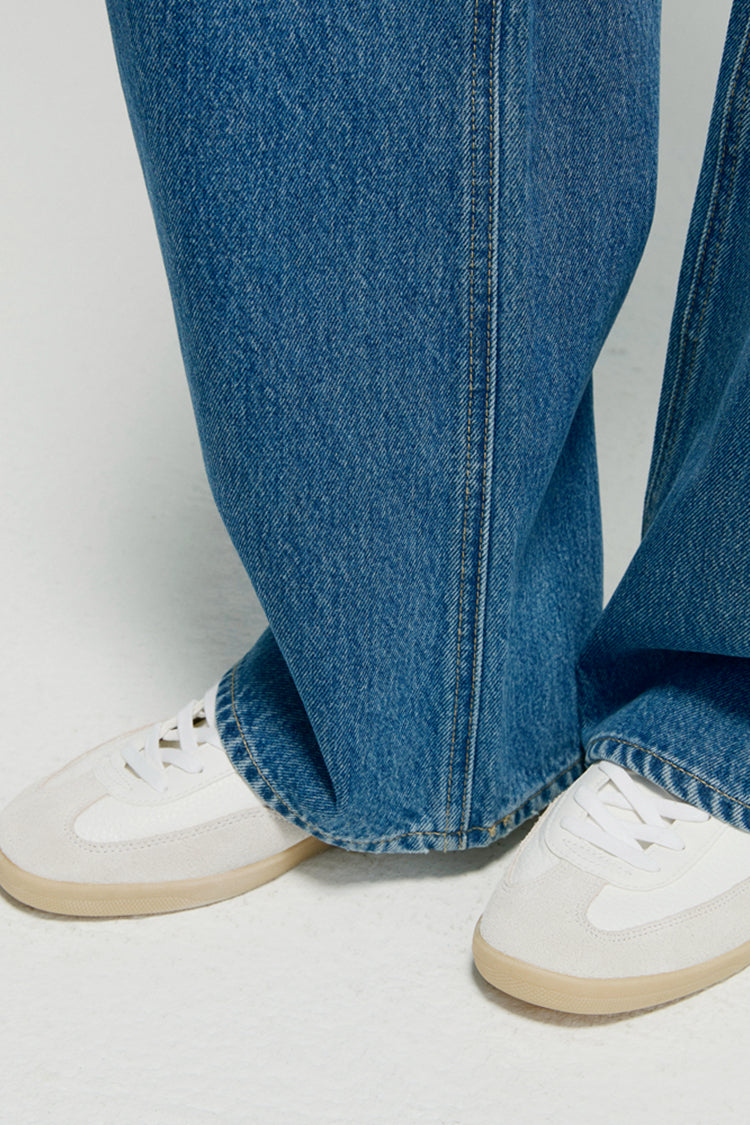 Hey Joanie Arc Jean HJ055, stylish high-waisted denim jeans displayed on a hanger with a light background.