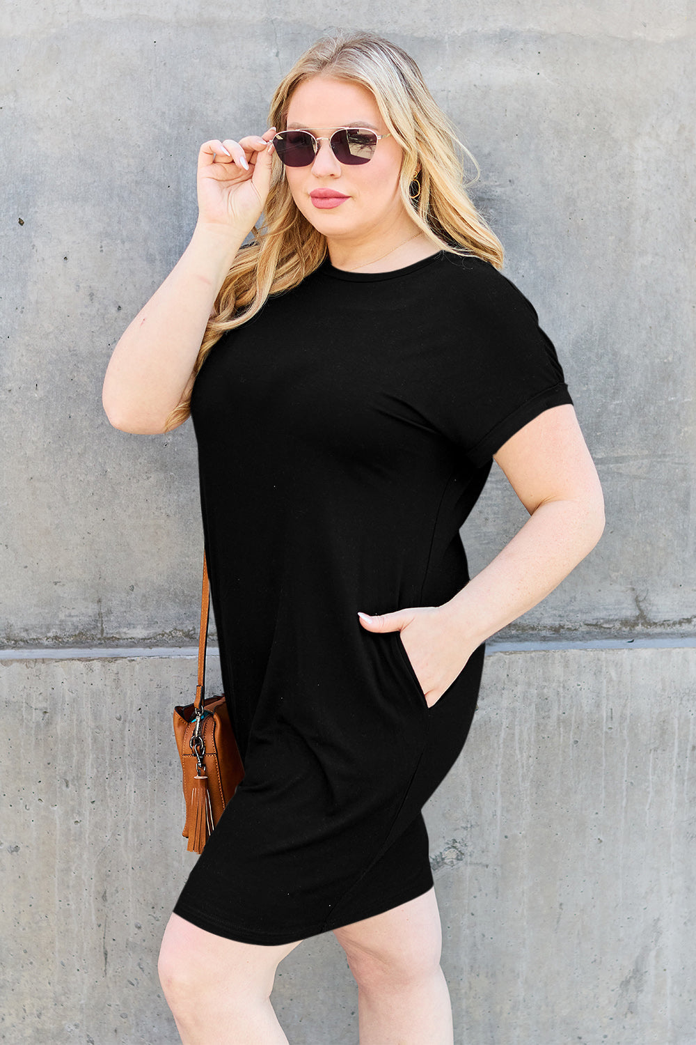 ShopBasicbae bamboo full-size round neck short sleeve dress with pockets, casual and comfortable, shown on a model.