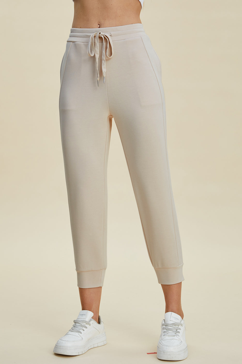 ShopBasicbae Basic Bae high waist cropped scuba pants with drawstring, full size, and stylish bottom design in neutral color.
