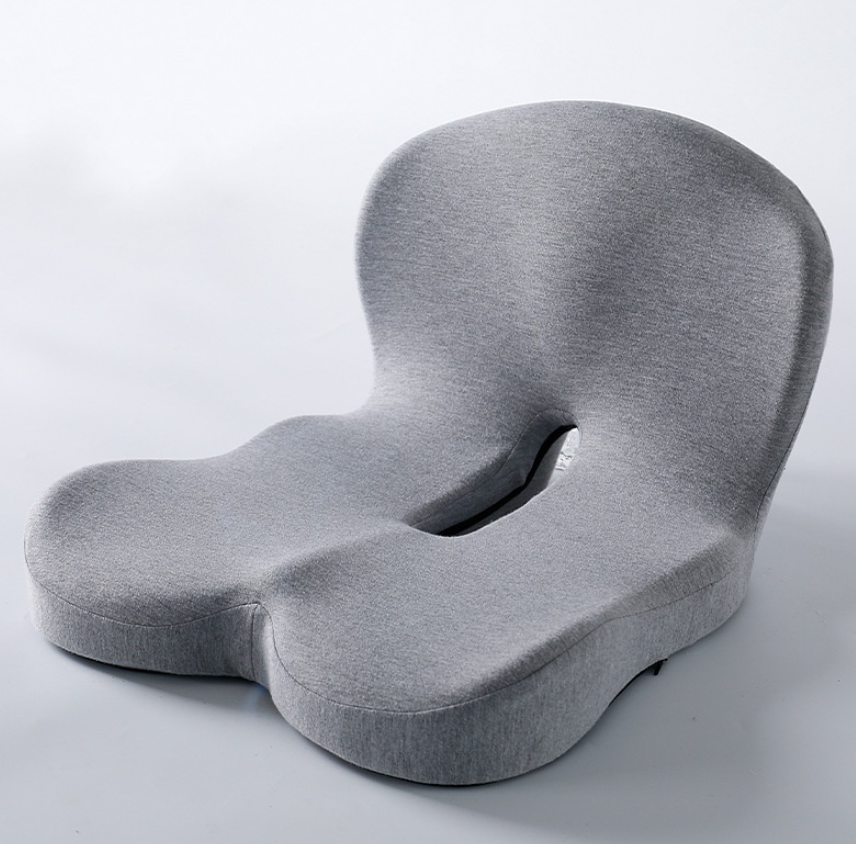 Memory foam ergonomic cushion by C&M treasures, shown with a contoured design for back and seat support, in neutral color.