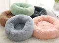 Round plush dog bed for small dogs and puppies by C&M Treasures, soft and cozy with a cushioned interior.