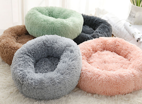Round plush dog bed for small dogs and puppies by C&M Treasures, soft and cozy with a cushioned interior.