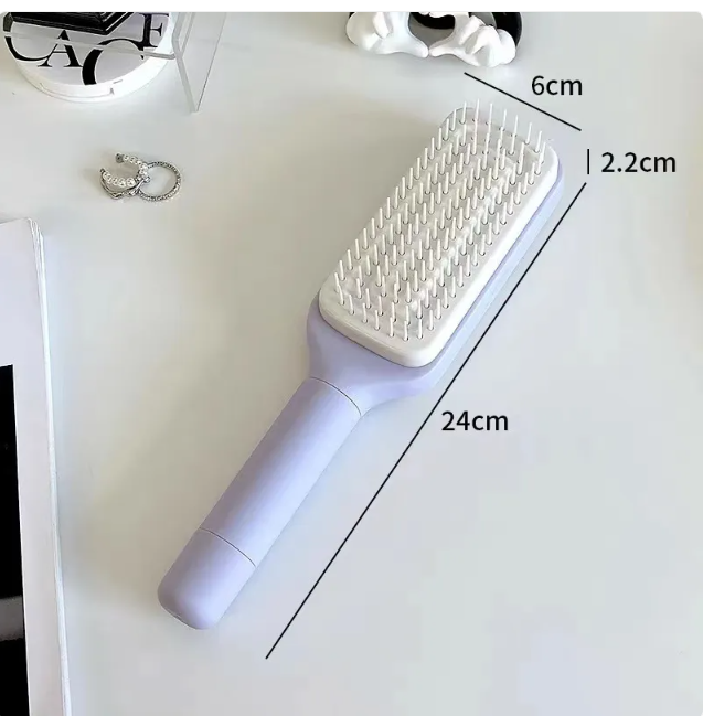 C&M Treasures 4-in-1 self-cleaning brush with ergonomic handle and multiple brush heads for versatile cleaning tasks