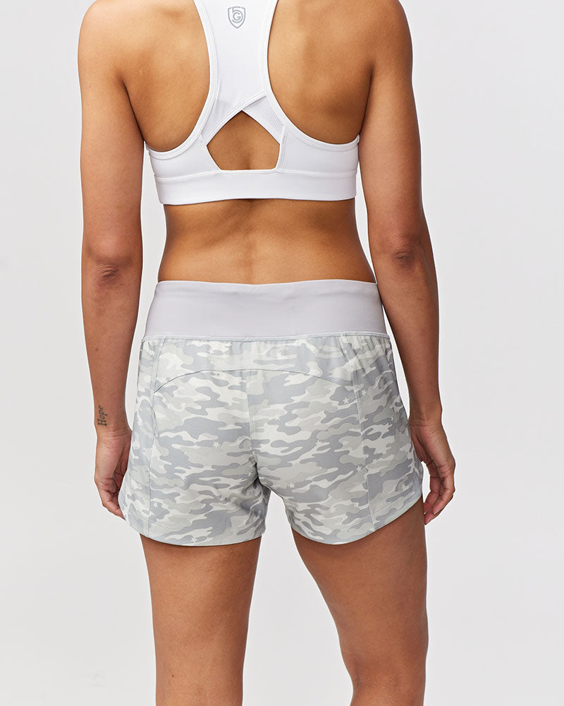Back view of Excel Women's Goal Five training shorts with camo print, designed for comfortable workout and training activities.