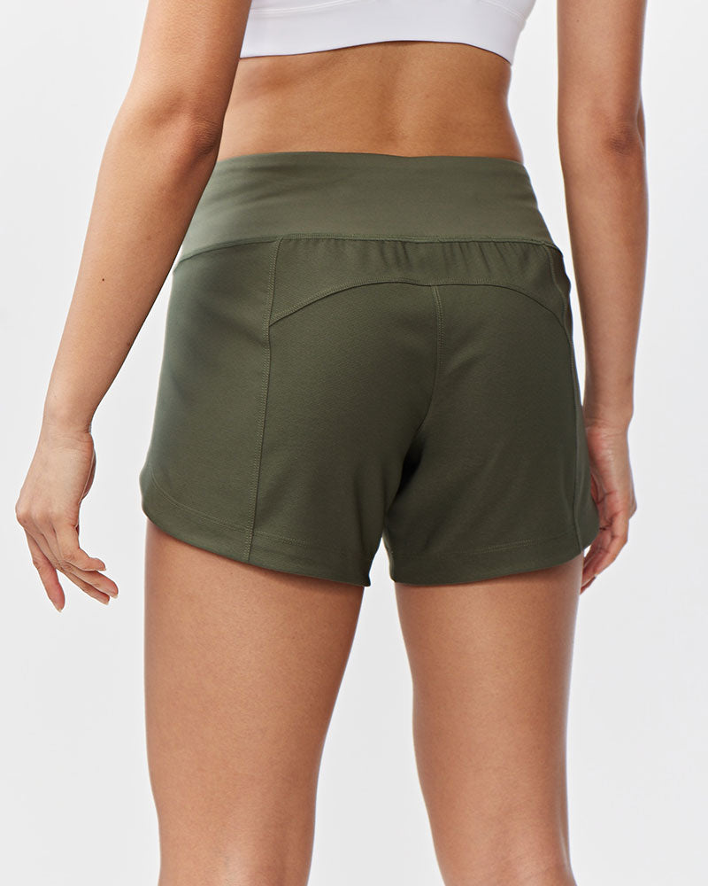 Dark moss green Excel women's training shorts by Goal Five, back view showcasing lightweight fabric and comfortable fit.