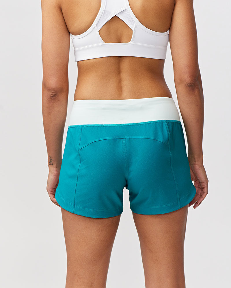 Excel women's training workout shorts in malachite and skylight colors, designed for active fitness and training.