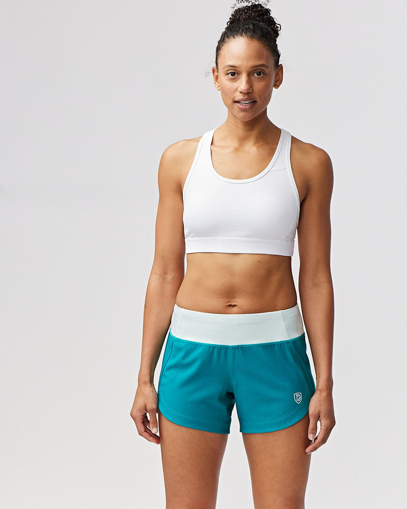 Excel women's training workout shorts in malachite and skylight colors, designed for comfortable active wear by Goal Five.