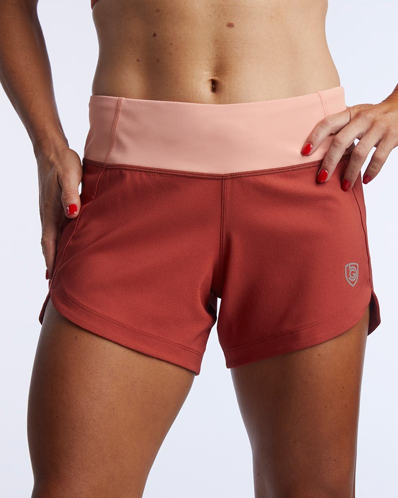 Excel women's workout shorts by Goal Five, training shorts in cinnabar and faded rose with a front view, breathable activewear.
