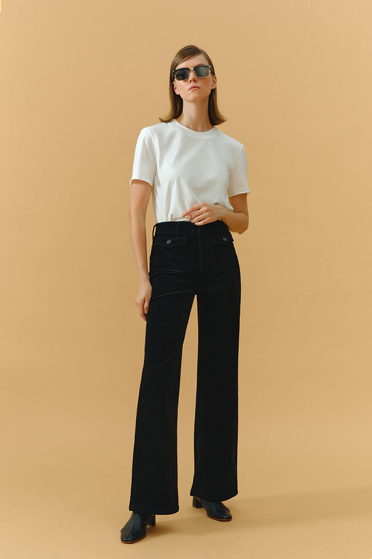 Hey Joanie 80's baggy corduroy pants in earthy brown with relaxed fit and wide legs, displayed on a hanger.