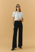 Hey Joanie 80's baggy corduroy pants in earthy brown with relaxed fit and wide legs, displayed on a hanger.