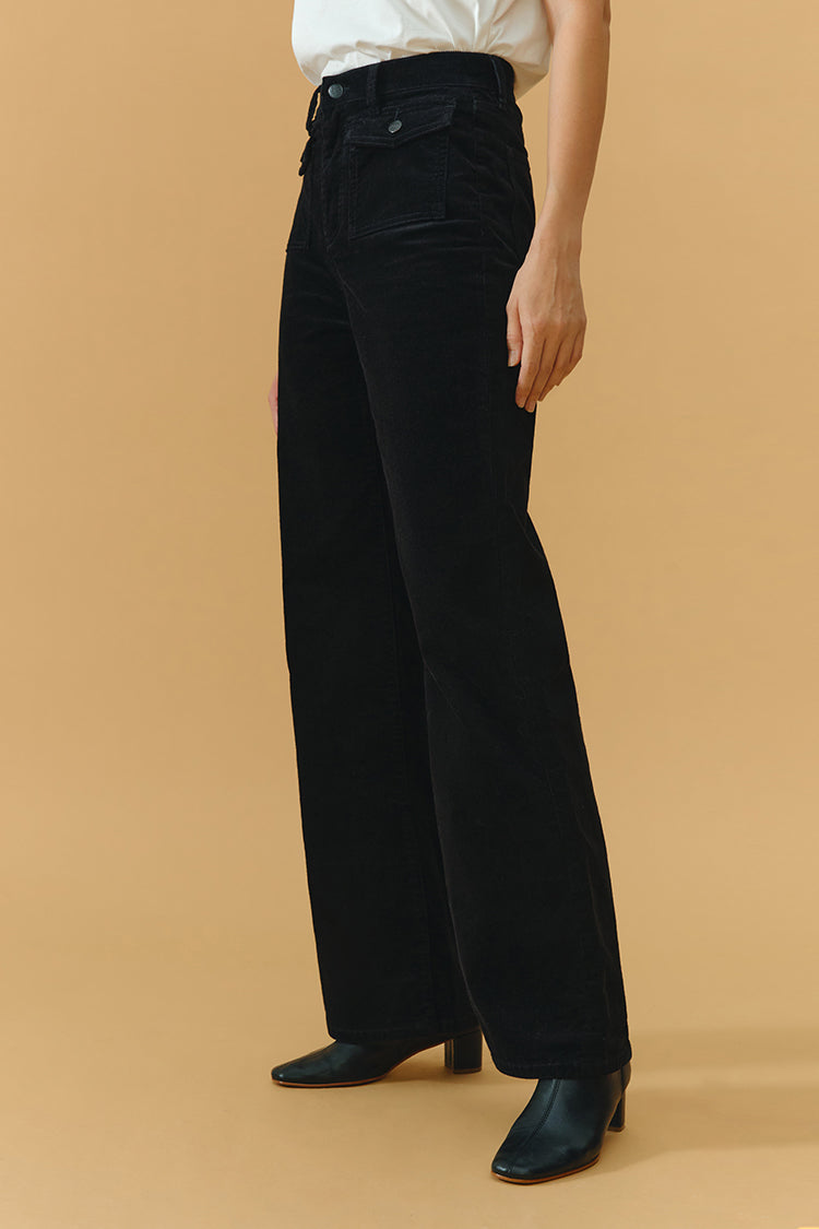 Hey Joanie 80's baggy corduroy pants in earthy brown, featuring a relaxed fit and high waist, displayed on a hanger.