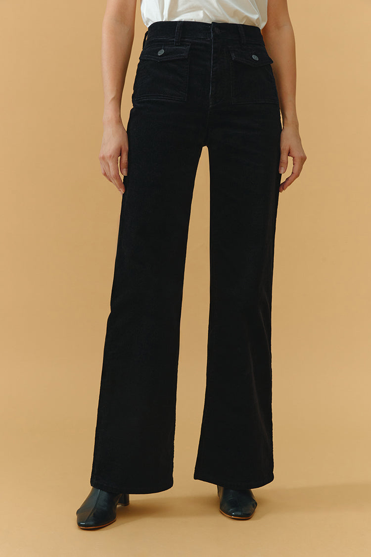 Hey Joanie 80's baggy corduroy pants in deep brown with wide legs and high waist, displayed on a hanger.