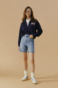 Hey Joanie Angeles High Rise Shorts in denim, front view showing fitted waistband and casual style.