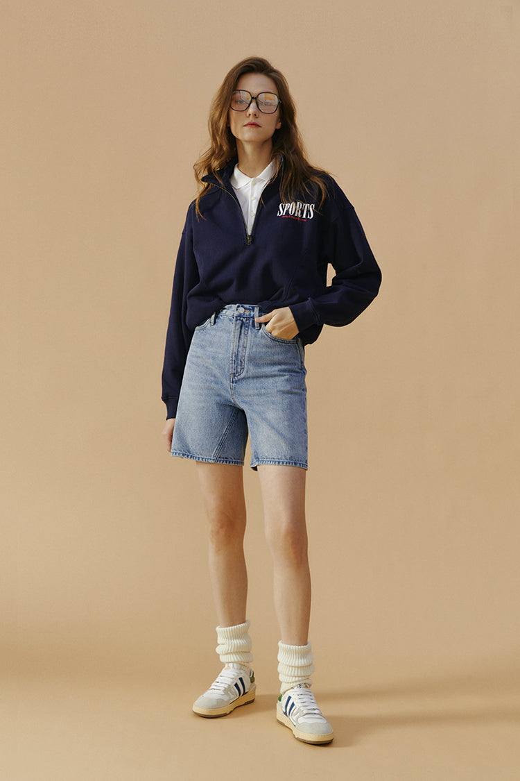 Hey Joanie Angeles High Rise Shorts in denim, front view showing fitted waistband and casual style.