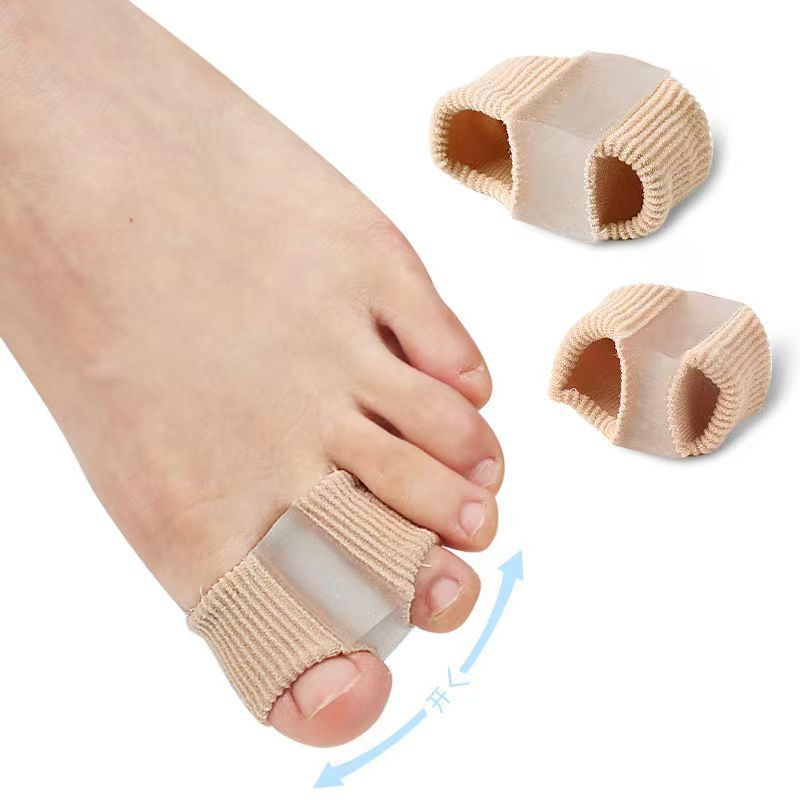 C&M Treasures fiber toe separator showing a soft, flexible silicone device placed between toes for comfort and alignment.