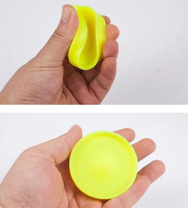 C&M treasures mini flying disc catching game with colorful discs and catchers on a grassy surface.