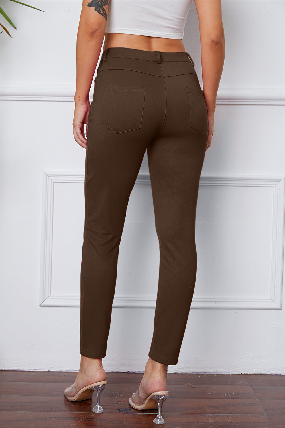 StretchyStitch Pants by Basic Bae, stylish black bottoms with a comfortable fit, shown on a model.