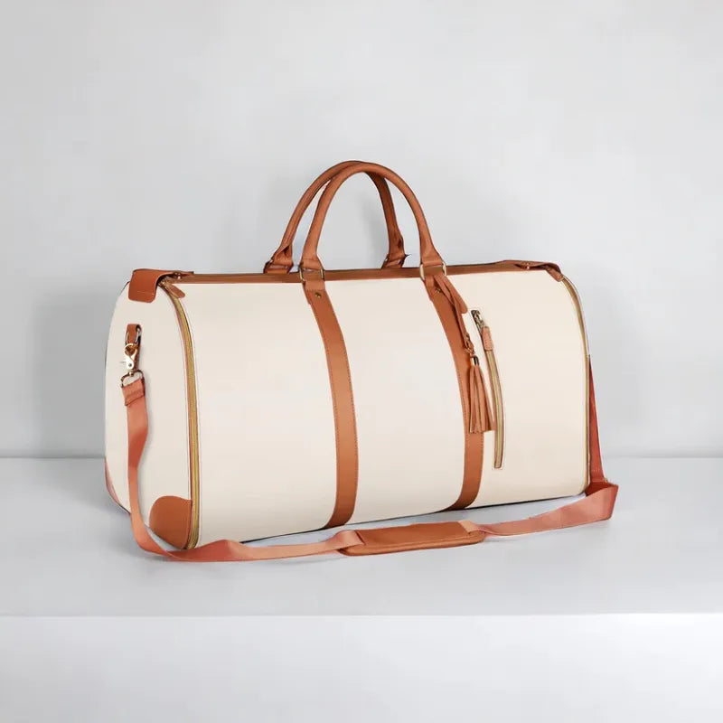 Foldable C&M Treasures travel bag made of durable material, shown folded and unfolded ready for packing and travel use.